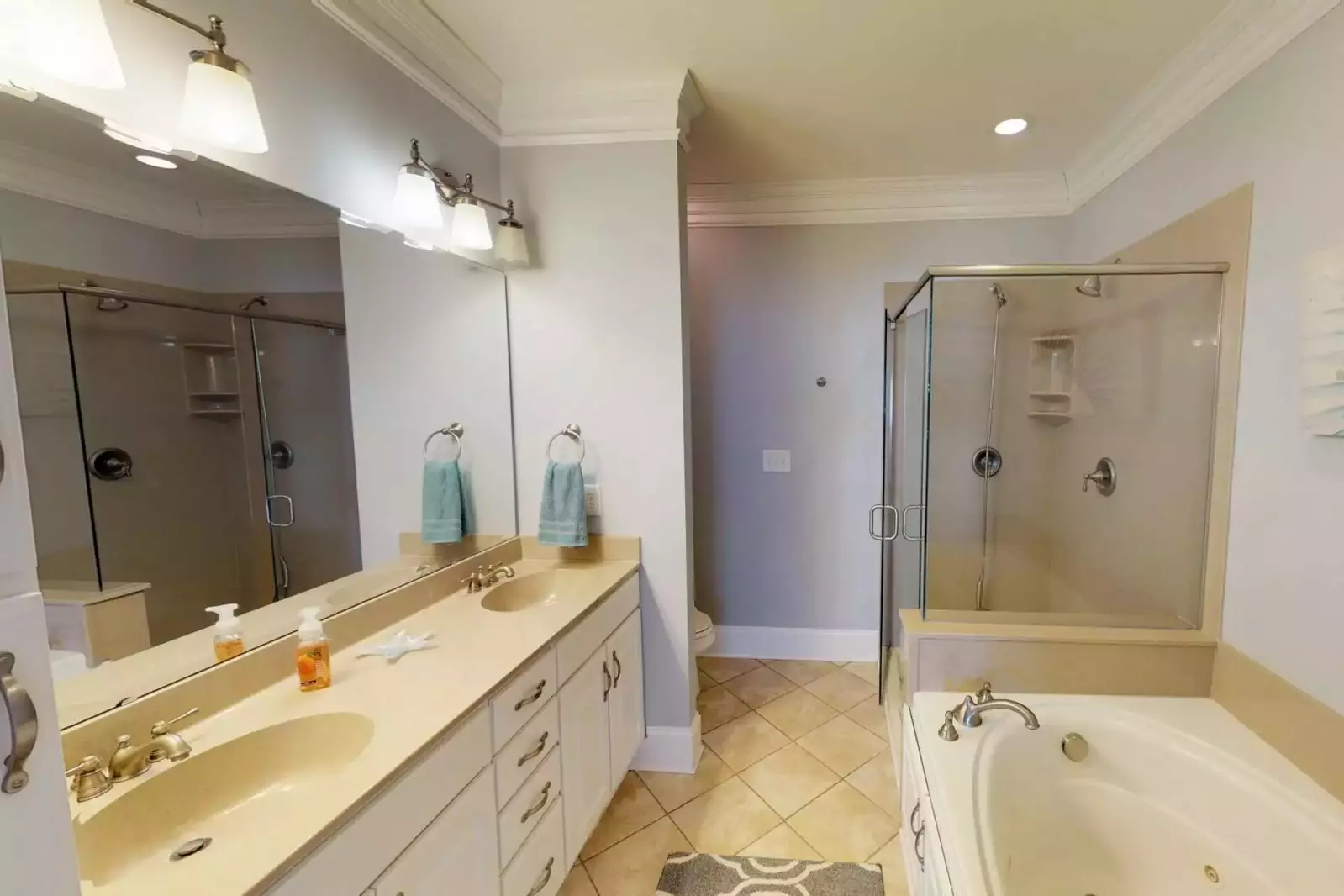 Owners suite bathroom has double vanity sinks, a walk in shower, and a large bathtub!