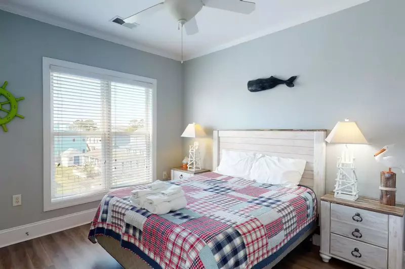 Nautical designed bedroom on the 2nd floor with a high-end memory foam mattress, sleep great at Carolina Beachside