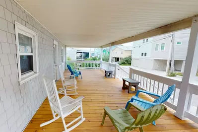 The large porch is close enough to the beach to hear the waves crashing.  You also have partial views of the ocean.