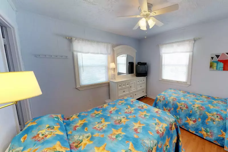 The kids can watch a little TV after beachtime in the second bedroom