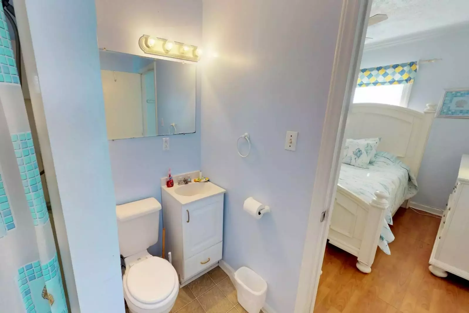 The bathroom has easy access from both bedrooms.