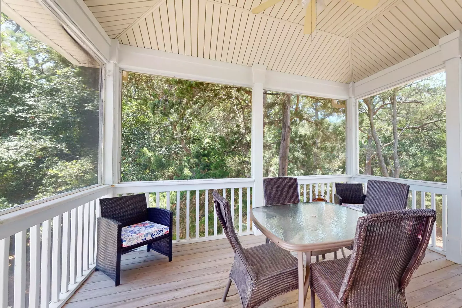 A large screened in porch located off the kitchen is perfect for morning coffee or playing a board game in the open air after beach time.