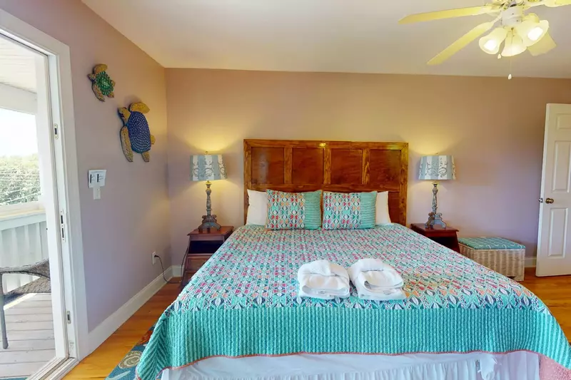 The second master has a king bed featuring comfortable memory foam