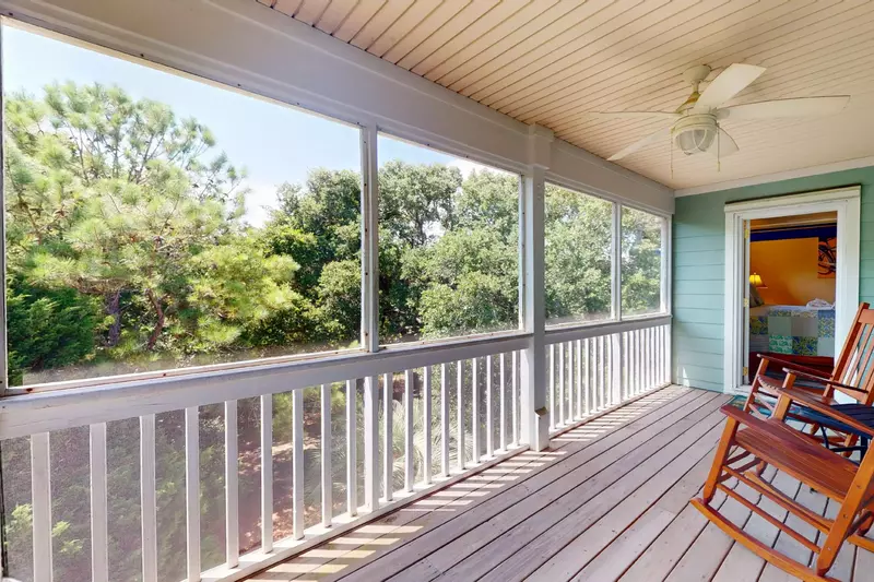 The bunk room opens to a large screened in porch