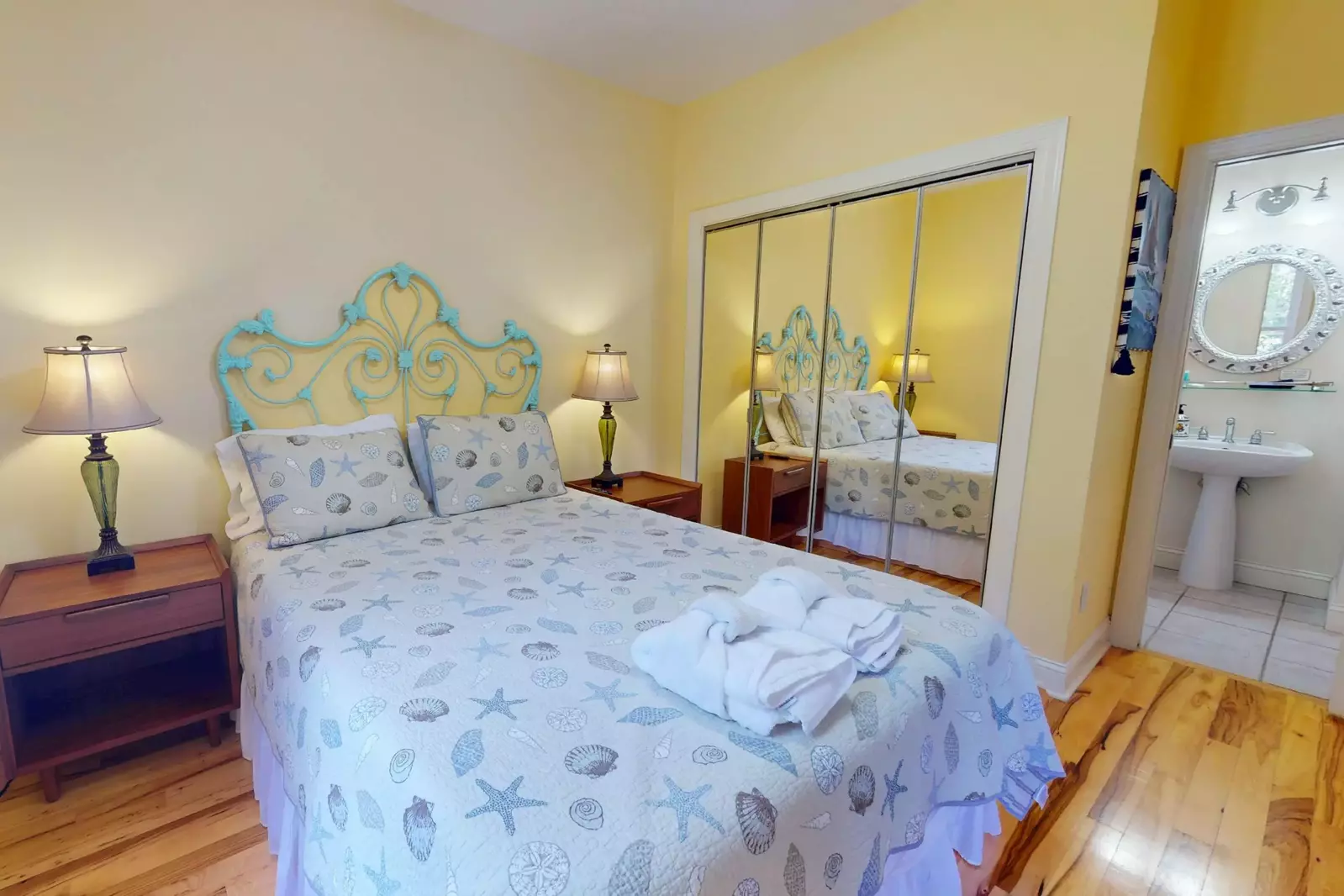 The bedroom on the main floor has its own full bath and has direct access to a roomy screened in porch.