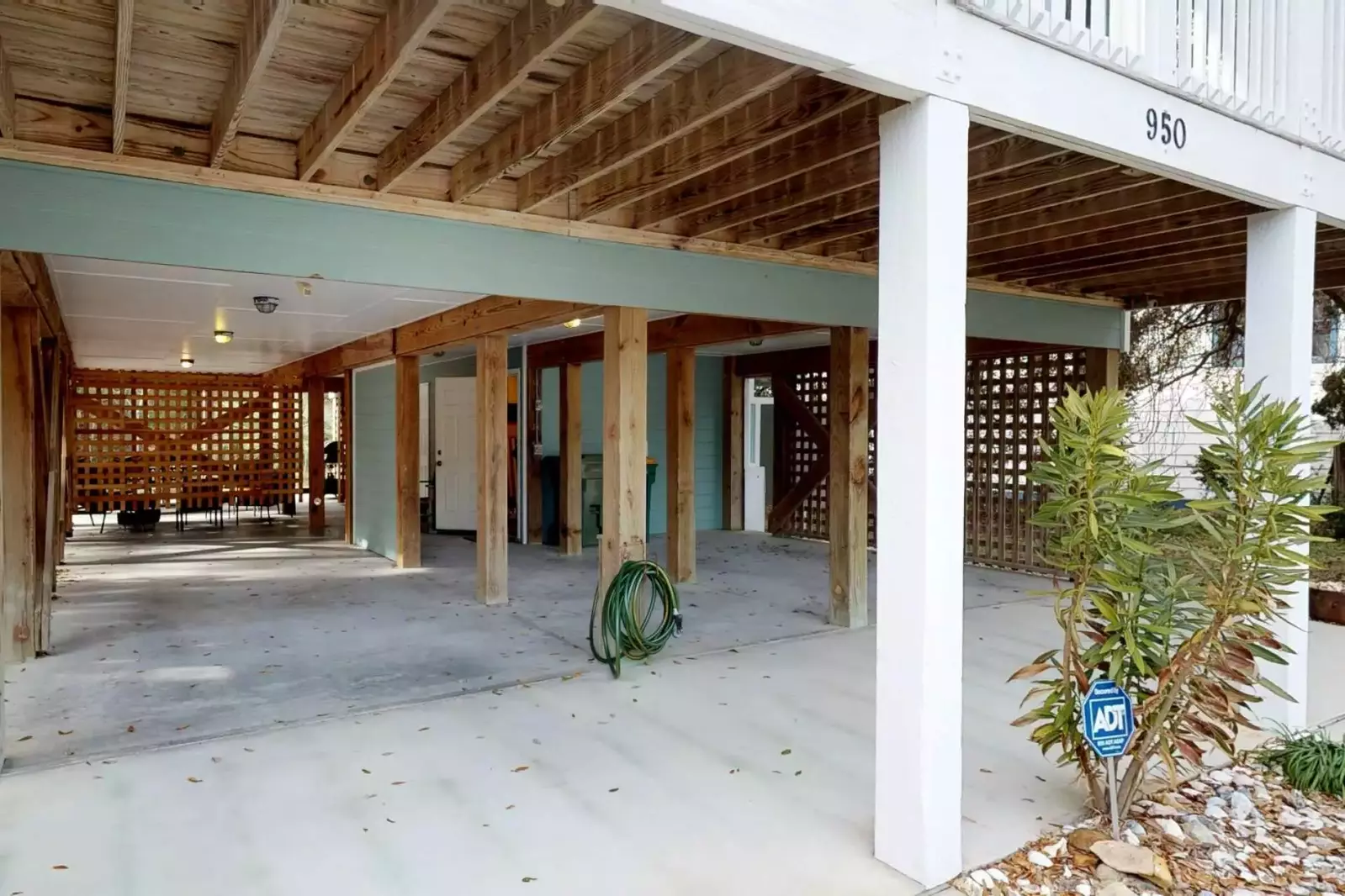 Plenty of covered parking a wash down area for rinsing off beach toys and an enclosed roomy outdoor shower on the ground floor