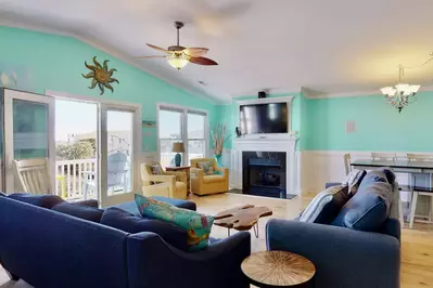 Watch TV with plenty of seating or have a meal at the large dining table