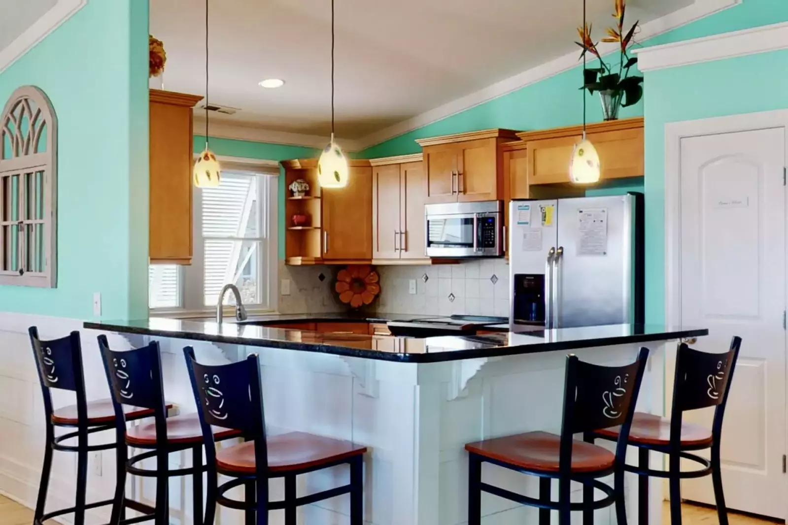 The breakfast bar has seating for a small group of people