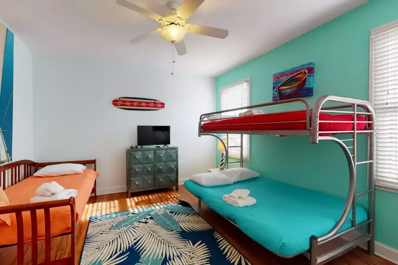 The kids room has a full/twin bunk and a day bed with a smart TV