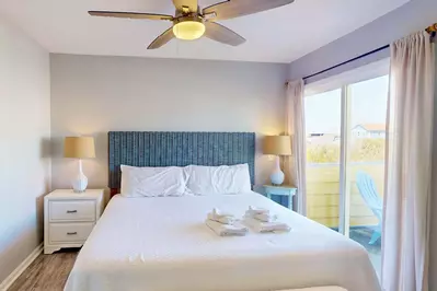 The master has excellent natural light and access to the back deck