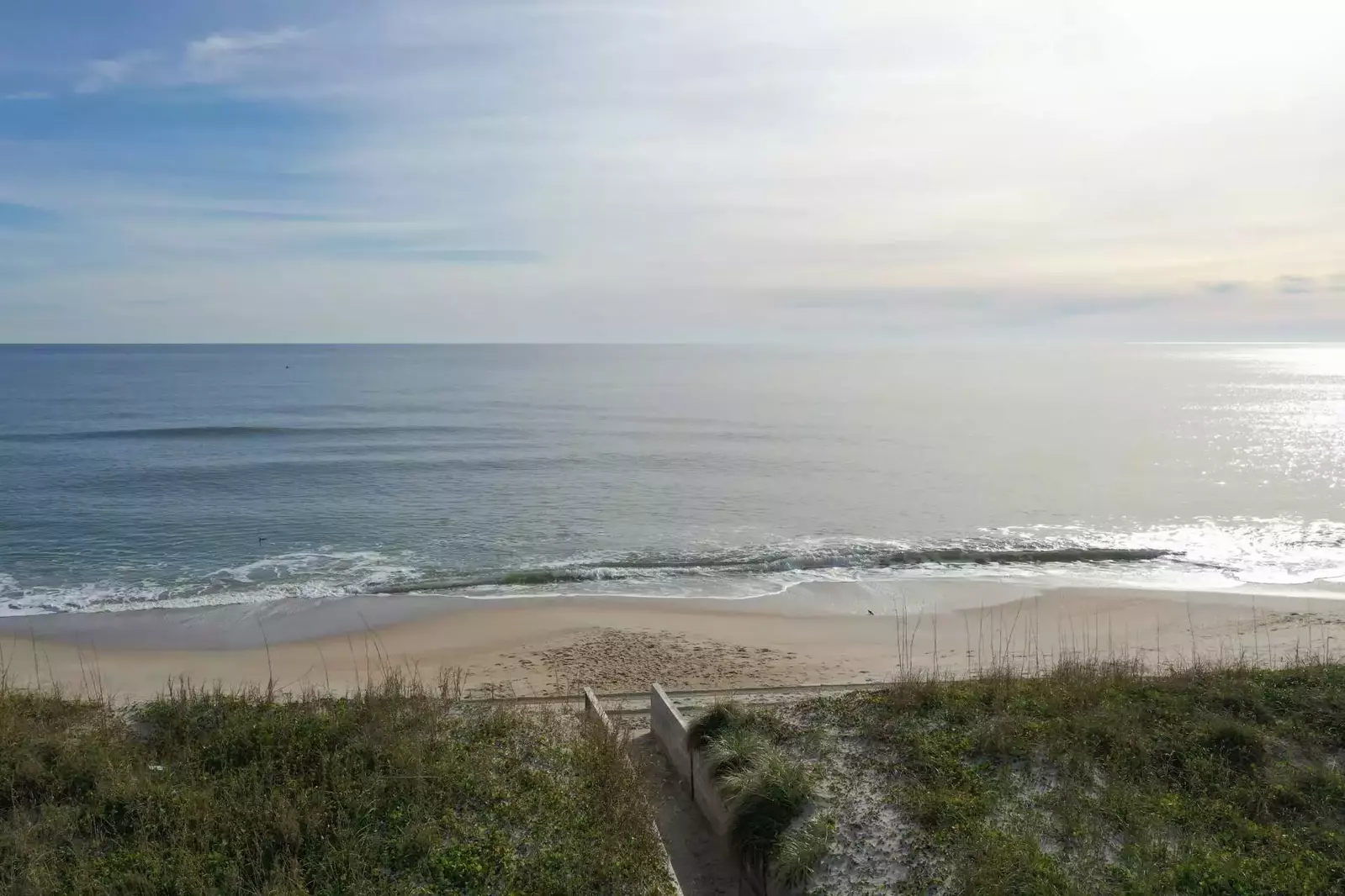 Beachfront Bliss is beachfront!  The beach access is very close to the condo, in less than a minute your feet are in the sand