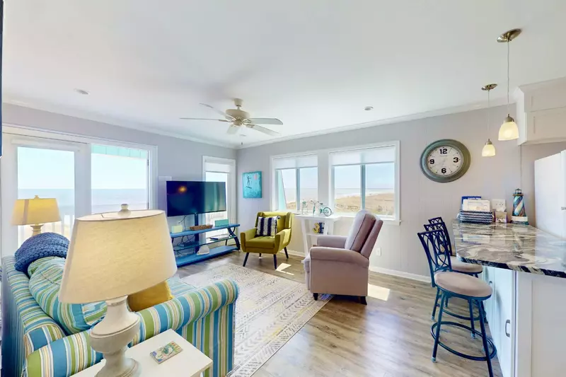 Beachfront Bliss is a top floor corner unit with great beach views from any of the areas in the main living space