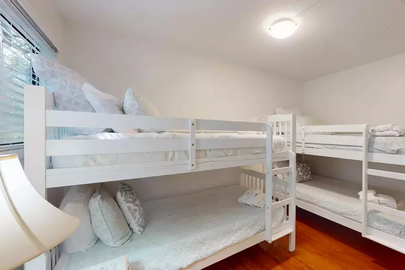 The third bedroom has 2 bunks, 4 twin beds, perfect for the kids