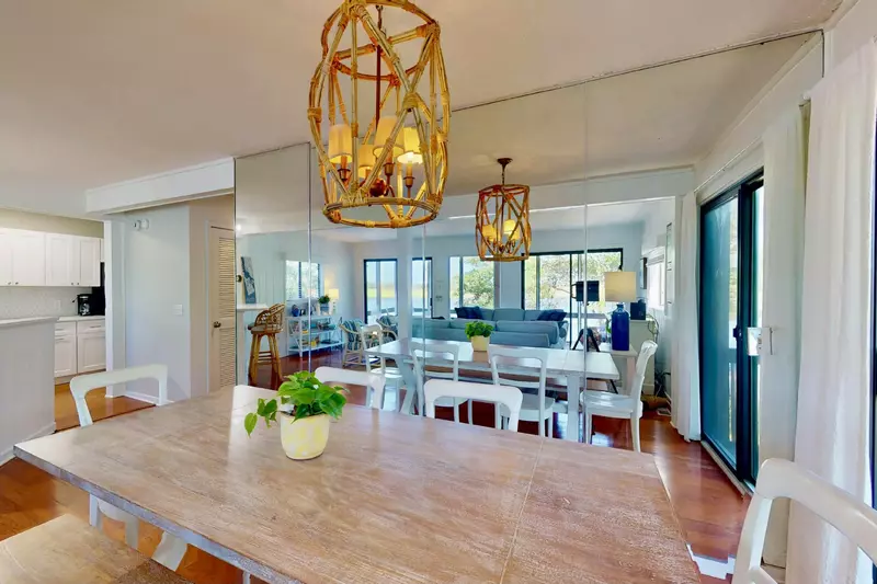 A floor-to-ceiling mirror adds depth and reflects natural light, making the space feel bright and expansive