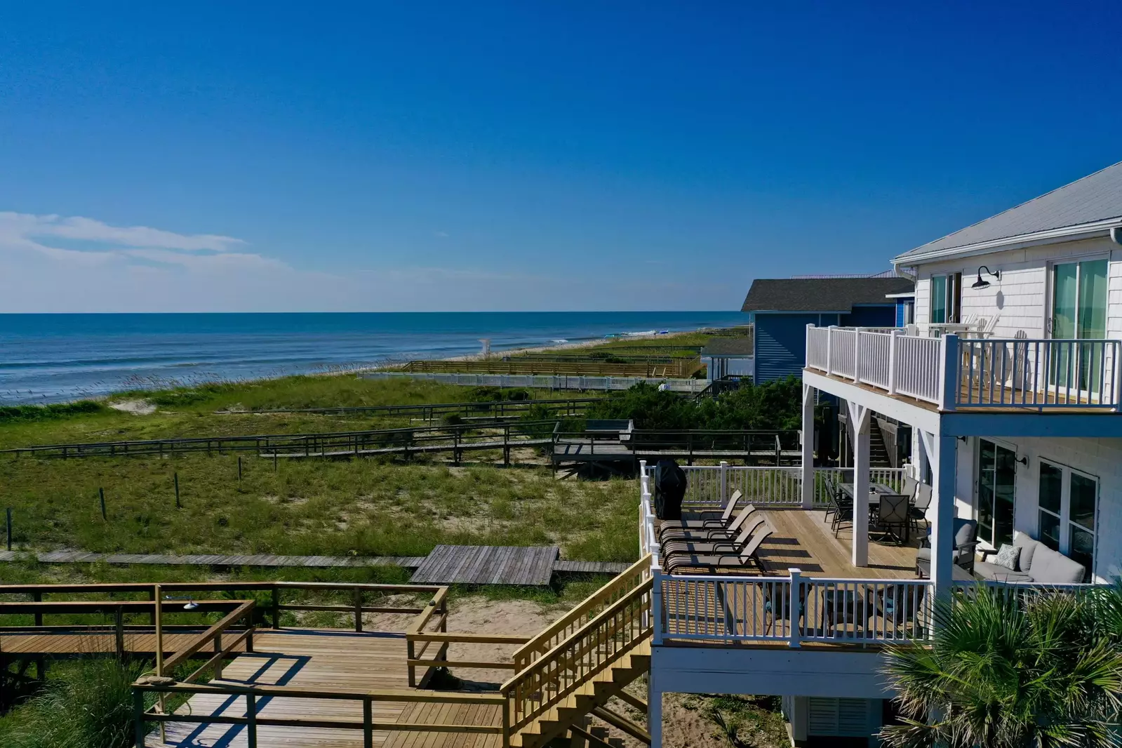The ocean is only steps away via your private walkway at this amazing house!