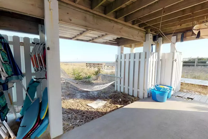 The property comes fully equipped with beach chairs, boogie boards, and the two buckets on the right are filled with beach toys for the kids!