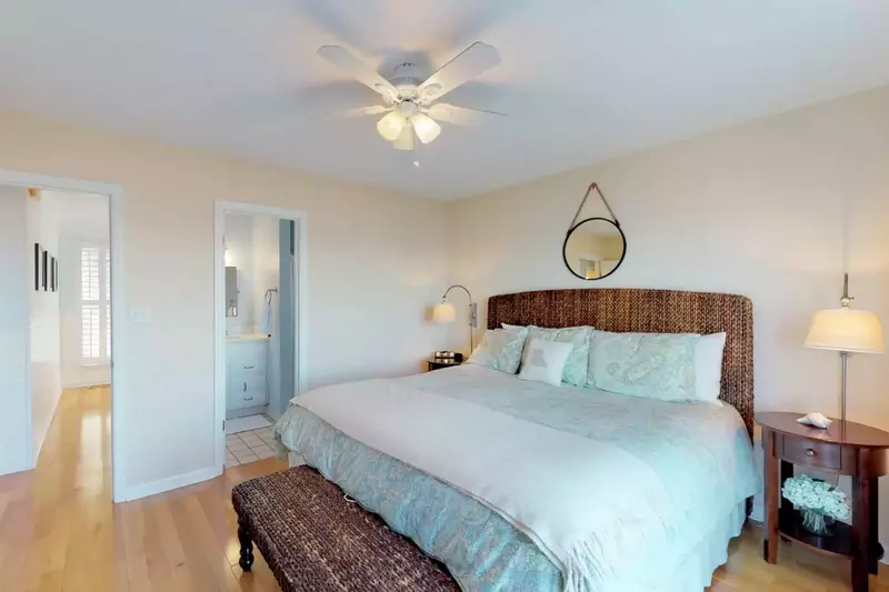 Master bedroom on the top floor includes a king bed with a full bath, towels are set out and beds are made upon arrival