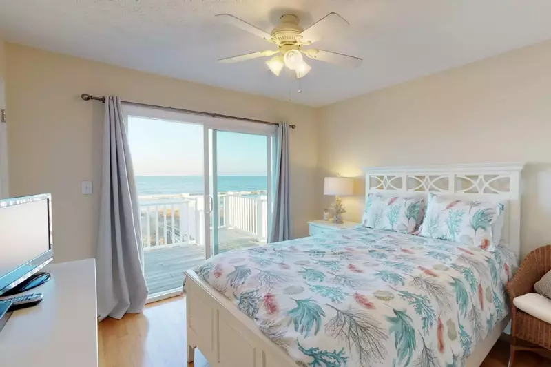 The top floor bedroom next to the master also has a view and a TV