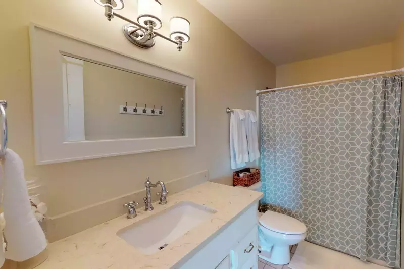 Full bath in the hallway on the top floor