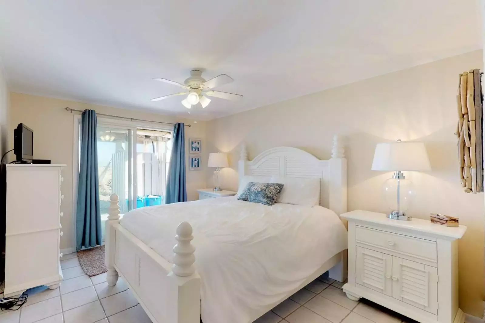 First floor bedroom with a sliding door to the backyard - private walkway to the beach
