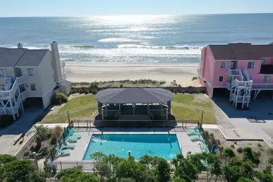 One of the outdoor pools is just a few steps away with ocean views and a covered gazebo