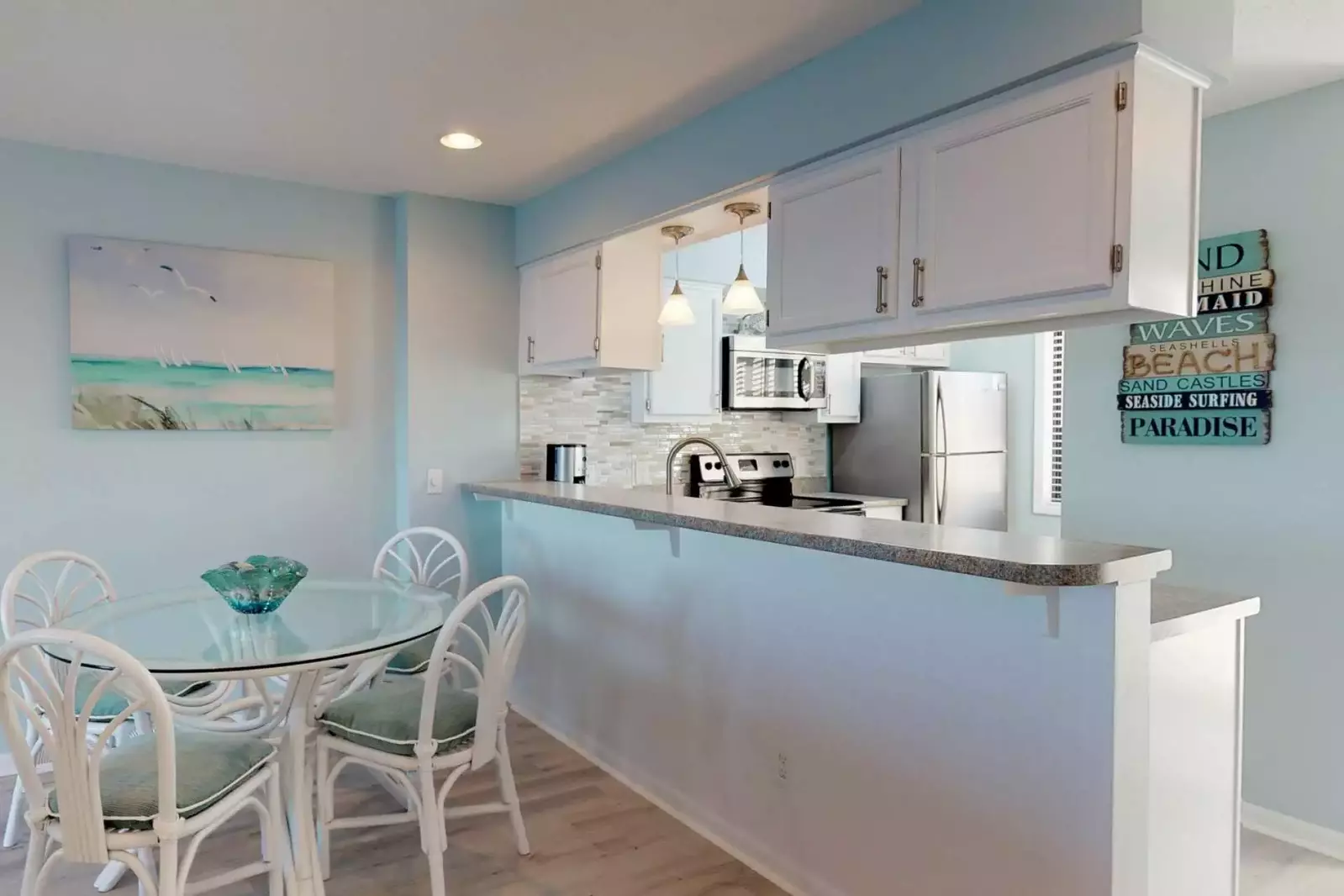 Breakfast bar is located near the dining area.  The kitchen has new appliances and countertops