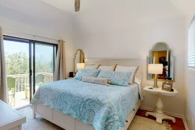 Main bedroom has access to a private porch with a full bathroom