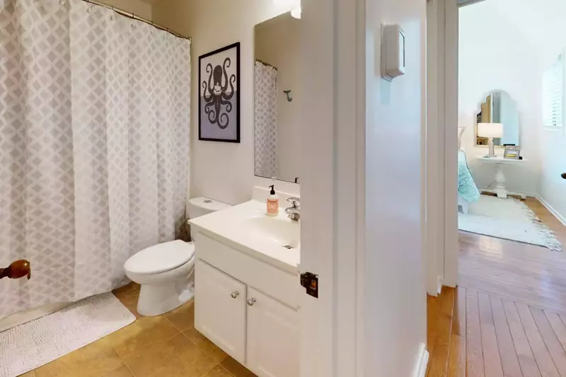 Full Bathroom in the hallway with a bathtub
