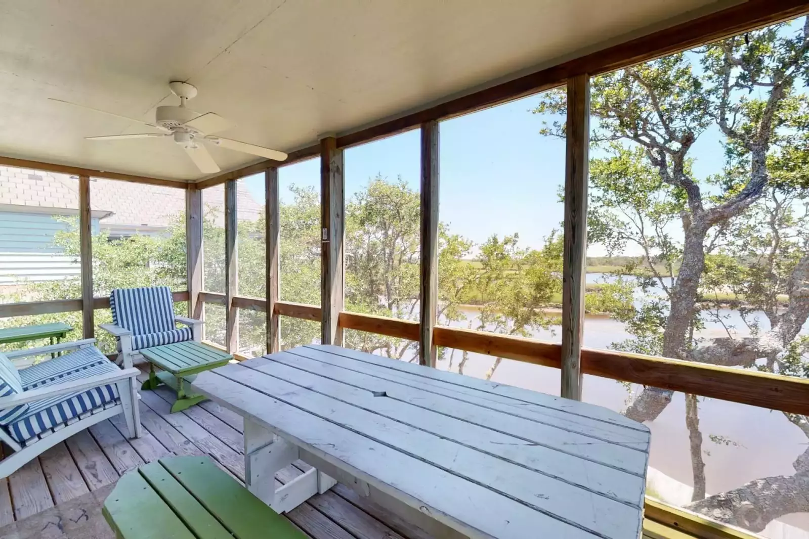 Relax in the screened in porch and read a book, watch the birds in the marsh or a have a nice meal on the large table