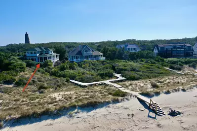 A walkway connects Green Teal to the beach