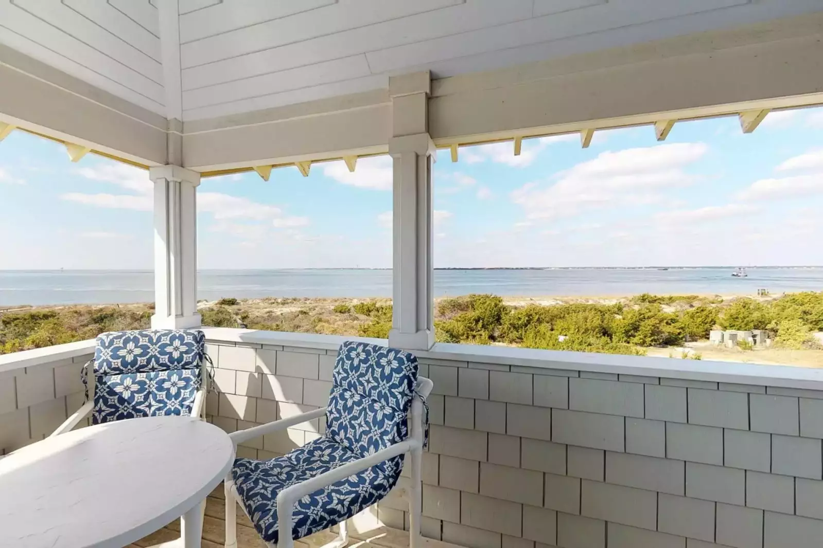 The top deck has seating for 8 and is perfect for having an adult beverage and watching dolphin, birds and whales feed