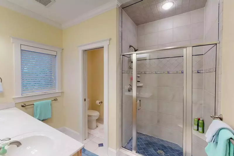 Bathroom for the owner suite on the main level with walk in shower