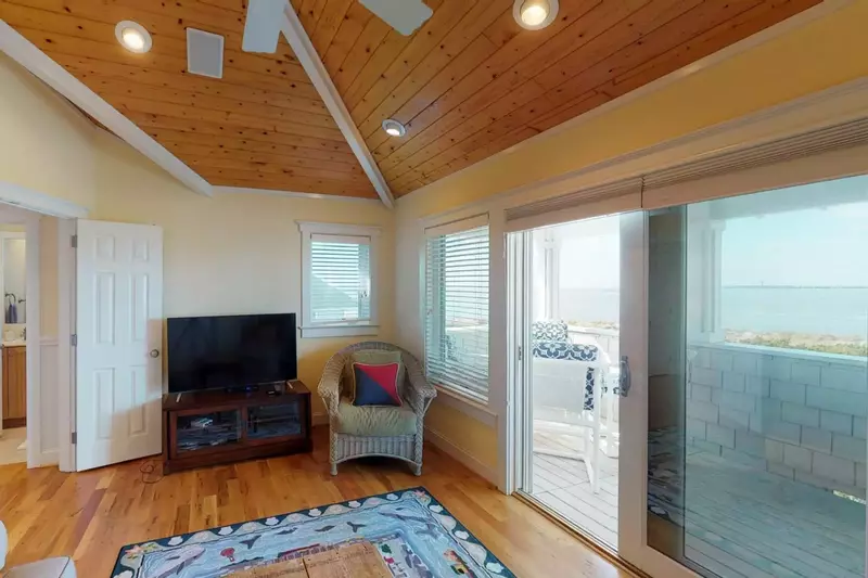 There is also an upstairs living room with a TV. Walk out onto the deck and enjoy that amazing view and sunset