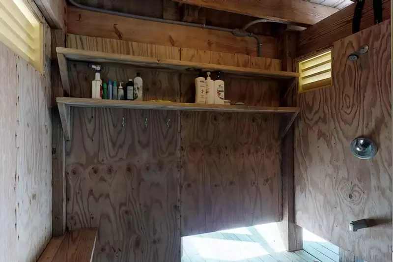 Outdoor shower is perfect for rinsing off all the sand before heading inside