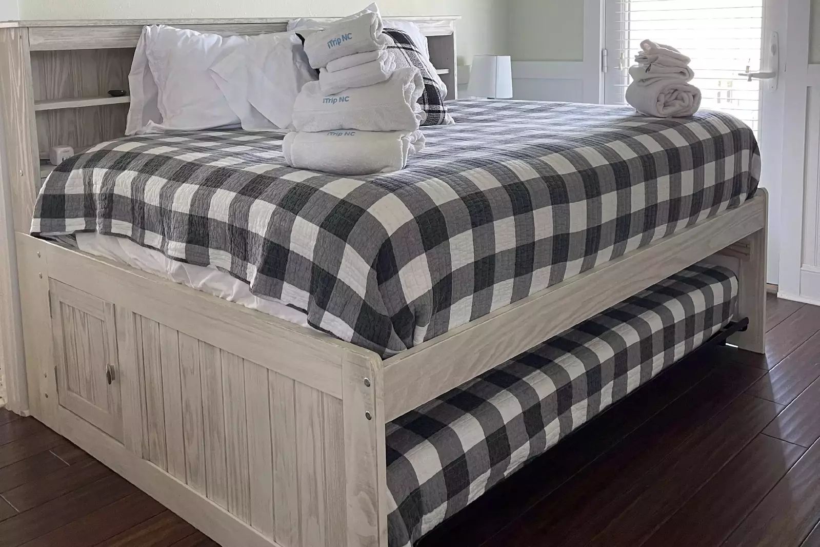 Upstairs there is a bedroom with a full bed over a twin trundle with access to a large deck and the Jack and Jill FUll Bathroom