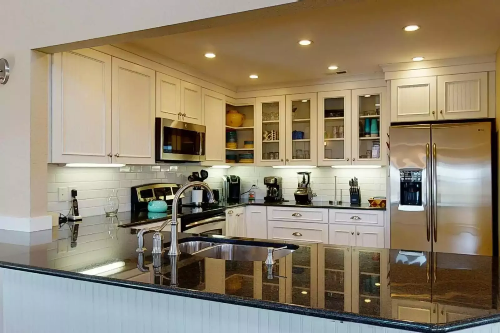 There is a nicely updated large granite counter in the kitchen so you can make that great meal for the entire crew