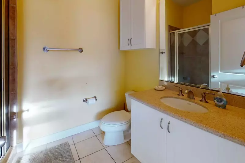 1st floor owners suite bathroom with large walk in shower