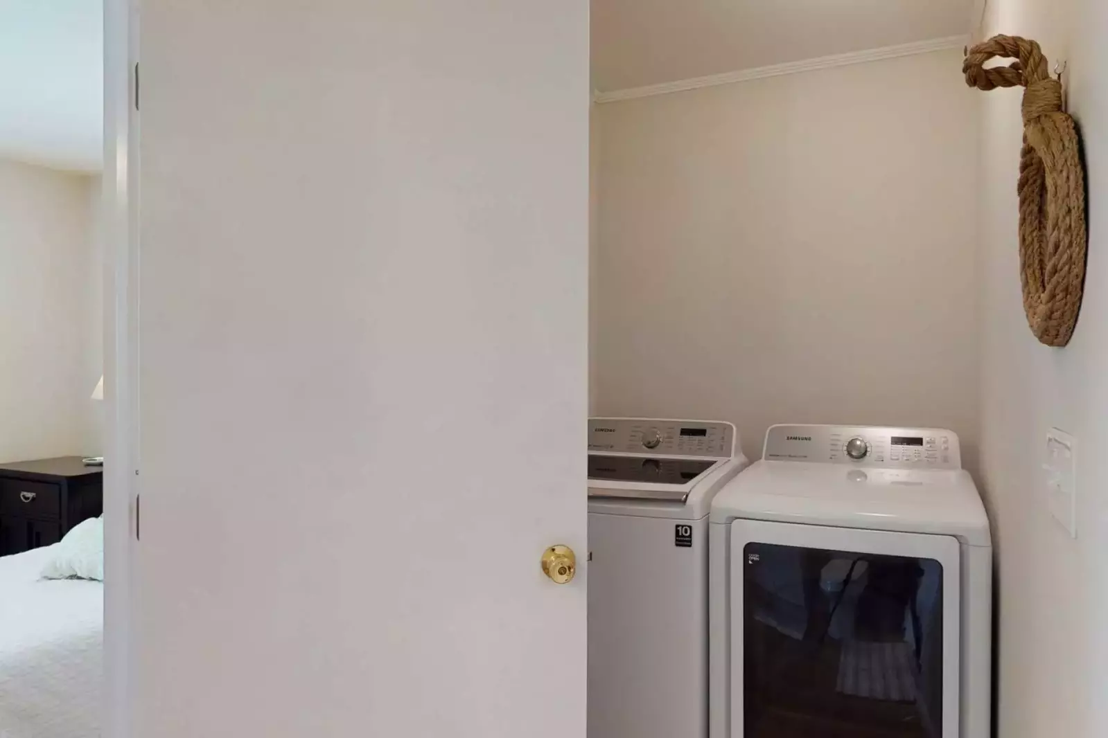 The updated laundry appliances are located in the en-suite bathroom