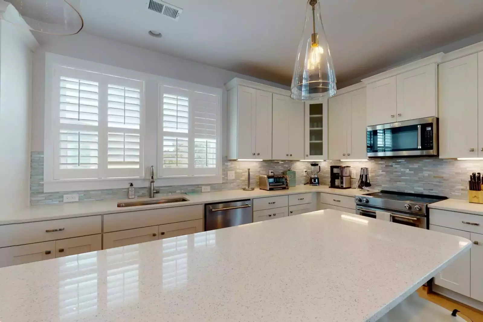 You will have plenty of room to make that family meal on the new quartz island counter top