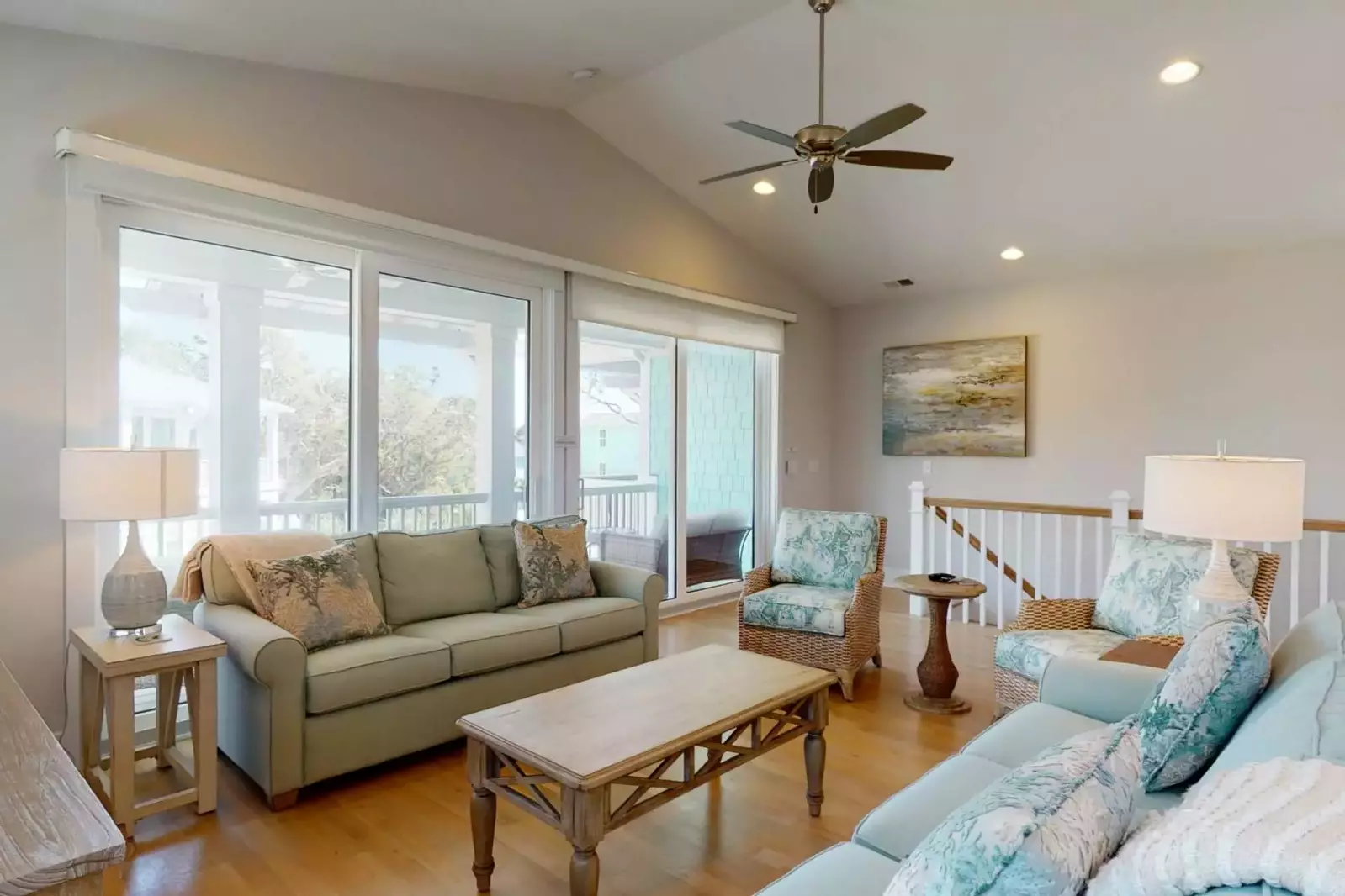 Large living space, wood flooring, high end furniture with access to huge deck.  This is a true luxury home