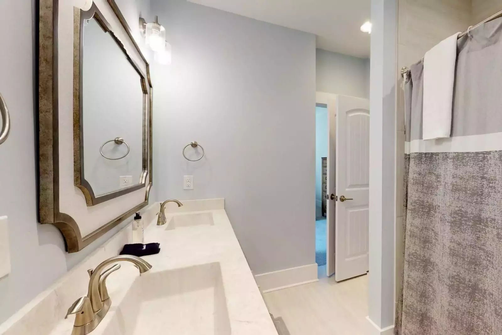 2nd floor hall bathroom has a tub shower and 2 sinks