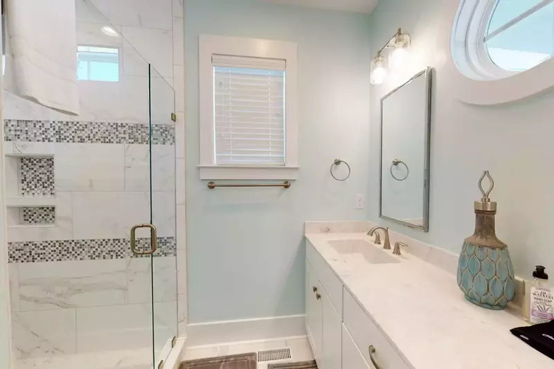 A true master bath with 2 sinks and private toilet area