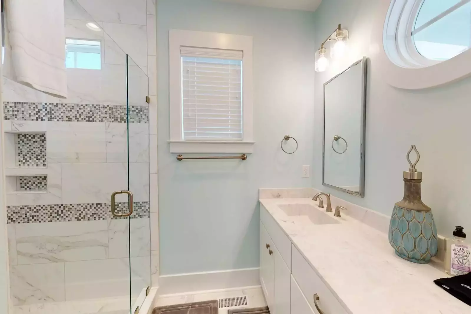 A true master bath with 2 sinks and private toilet area