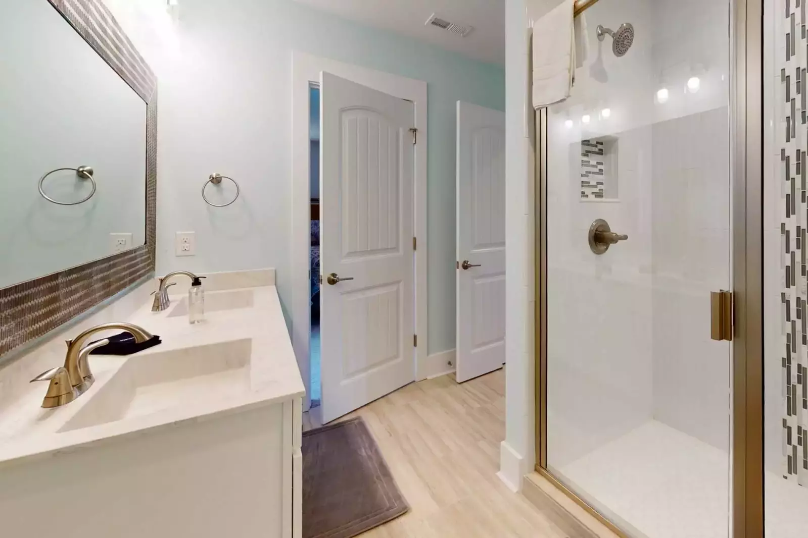 1st floor hall bathroom has a large walk in shower and 2 sinks