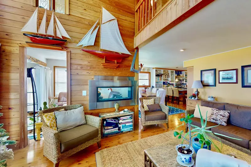 The main living area is connected to the dining area and second living area