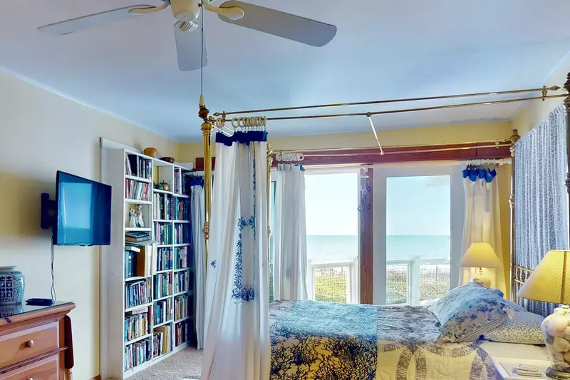 The primary suite has lovely ocean views and a wall mounted tv