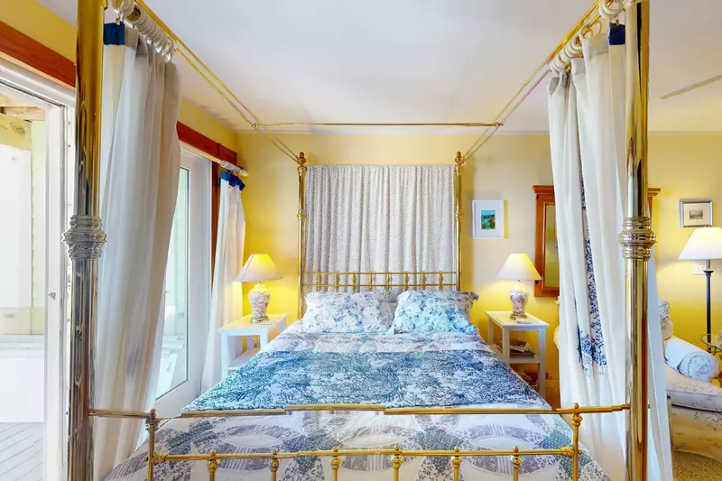 The primary suite has a sitting area and a four poster bed