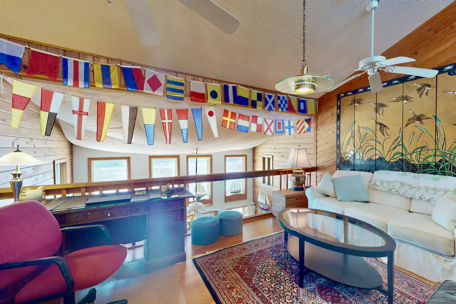 Take in an ocean view from the upstairs living area and desk