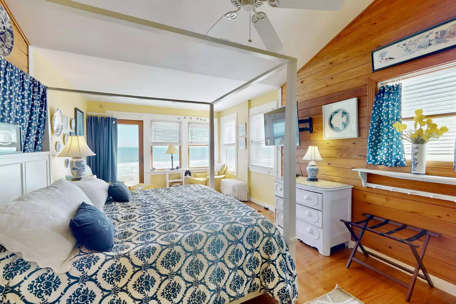 This second bedroom features a king bed, ocean view and sitting area