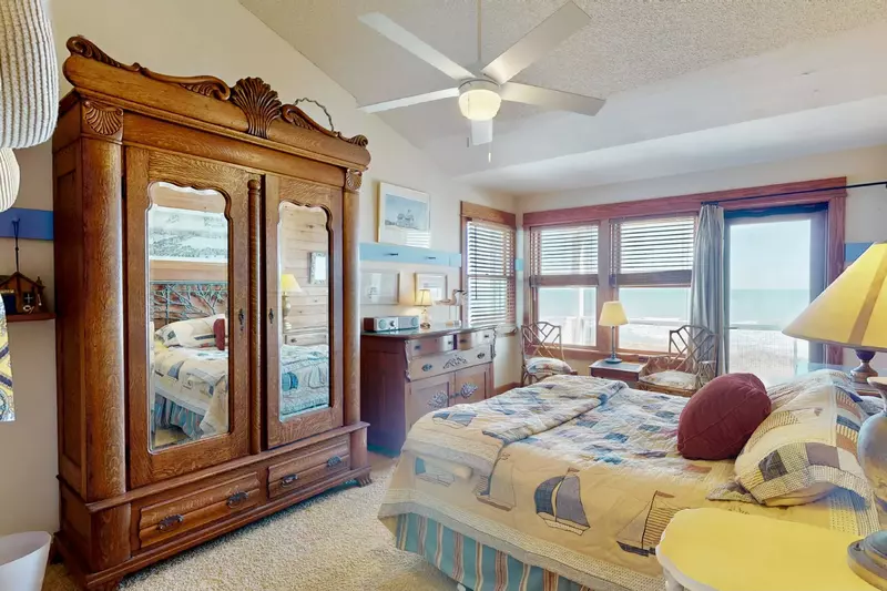 Take in the ocean view from this top floor queen bedroom with access to the hall bathroom and a private deck